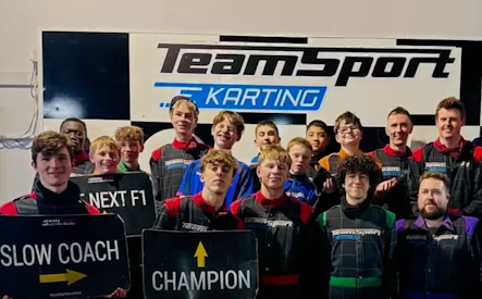 the boys and staff on the podium