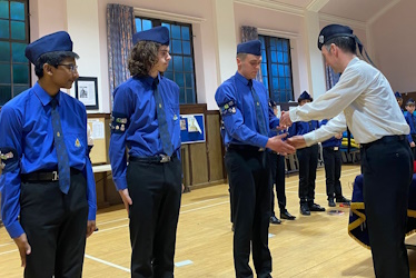 Boys receiving their Queens Badges